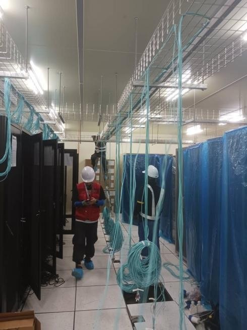Rows of network equipment racks in a server room